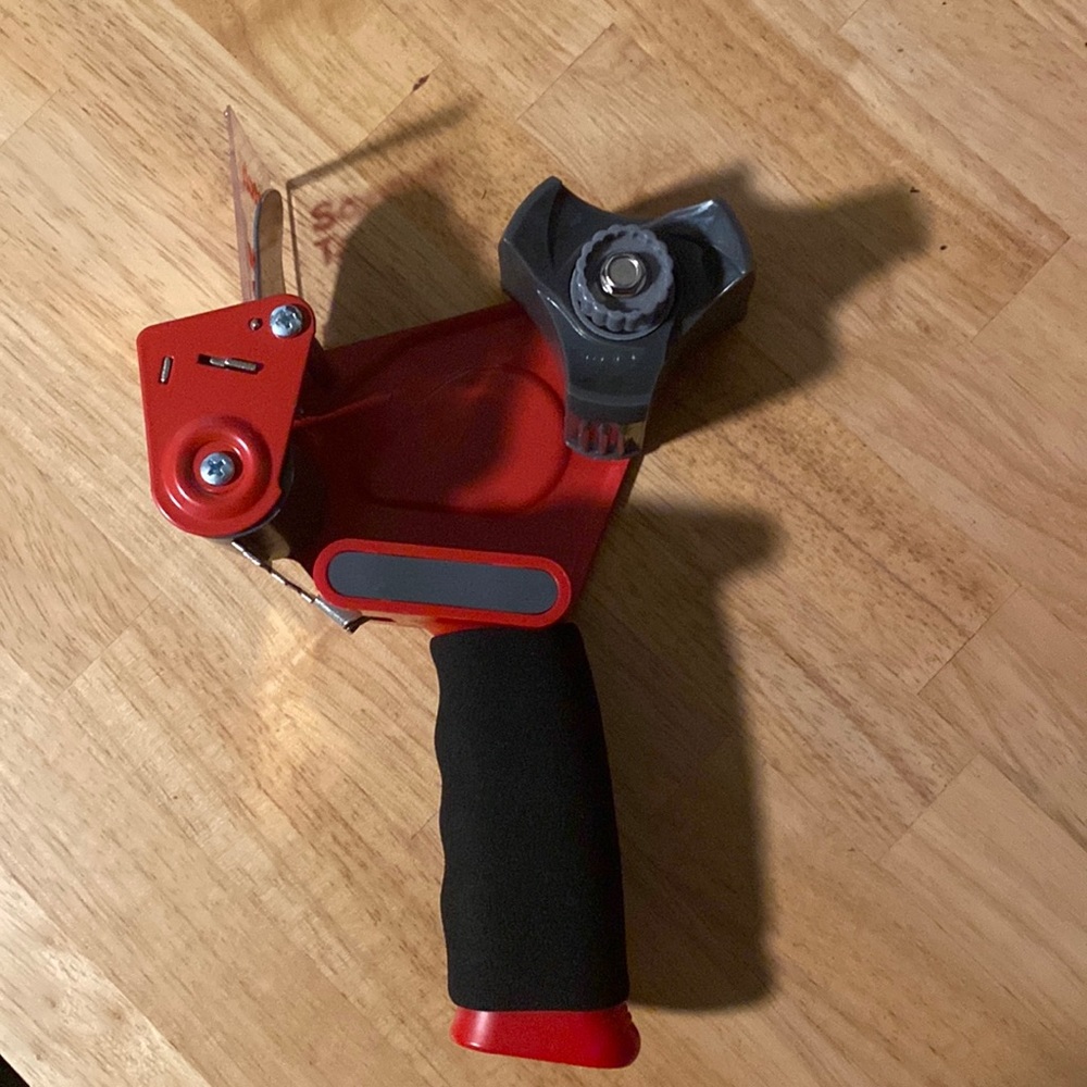 Packing tape dispenser
